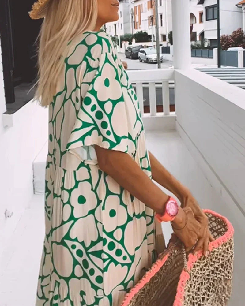 CHRISTINE | Långt sommarklänning med flödande snitt och eleganta grafiska mönster