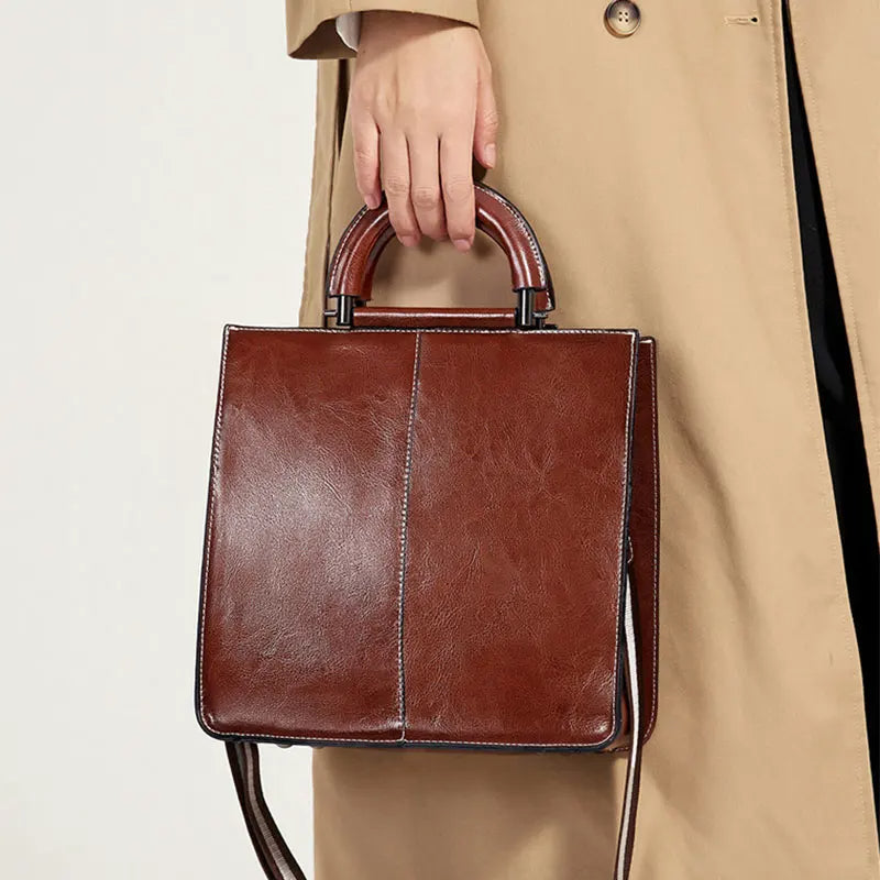 Strukturerad crossbody-väska med handtag