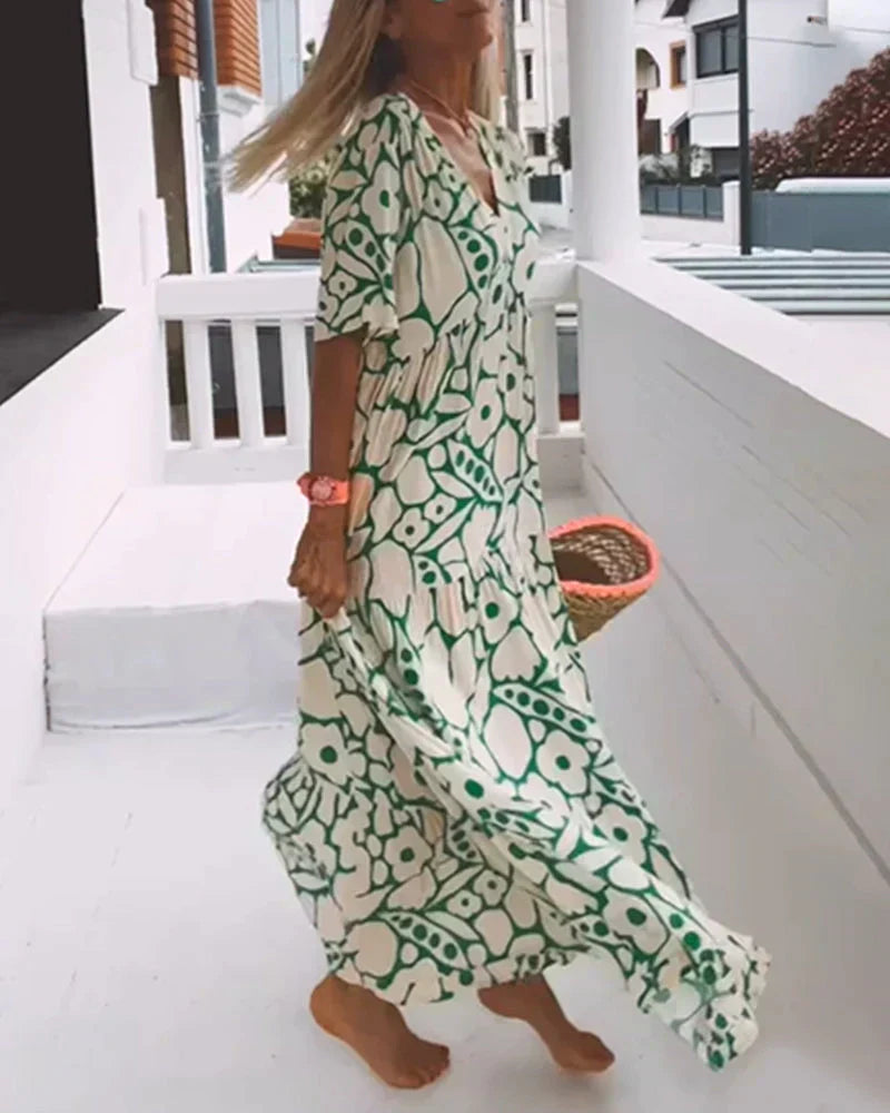 CHRISTINE | Långt sommarklänning med flödande snitt och eleganta grafiska mönster